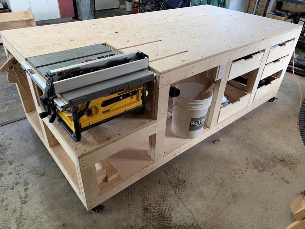 Woodworking workbench under construction with a table saw